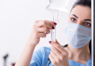Scientist examining test tube
